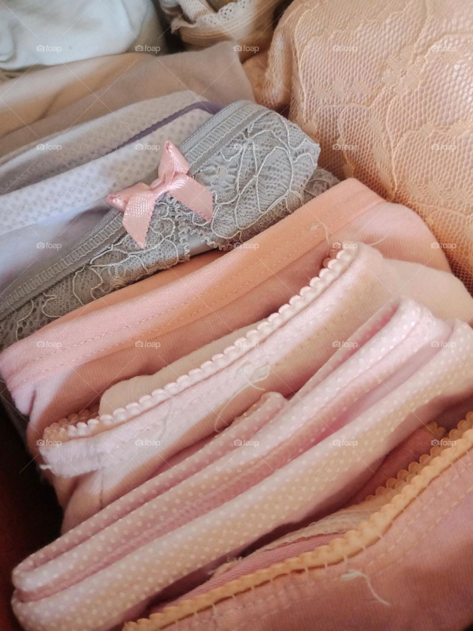 A close up of folded pink underwear