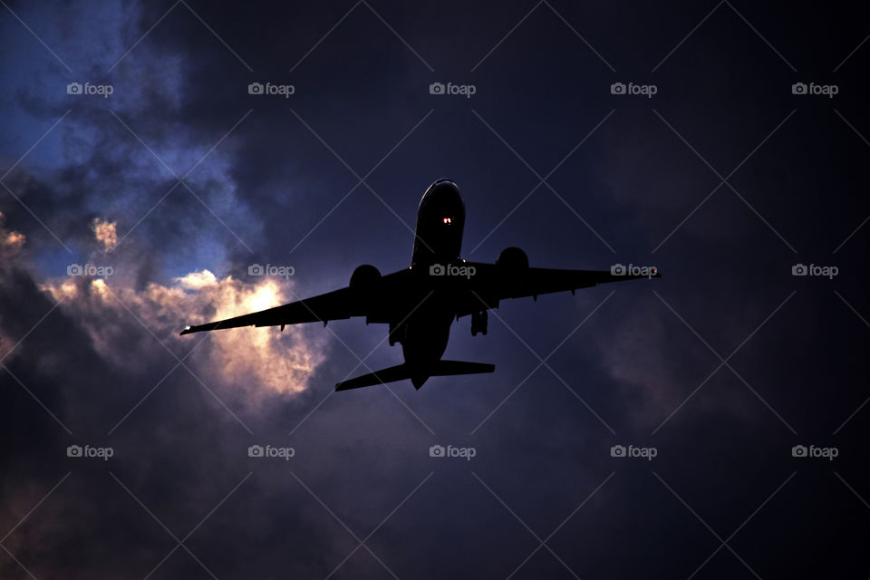 A Pakistan Airlines B777 on approach to Islamabad on a stormy evening.