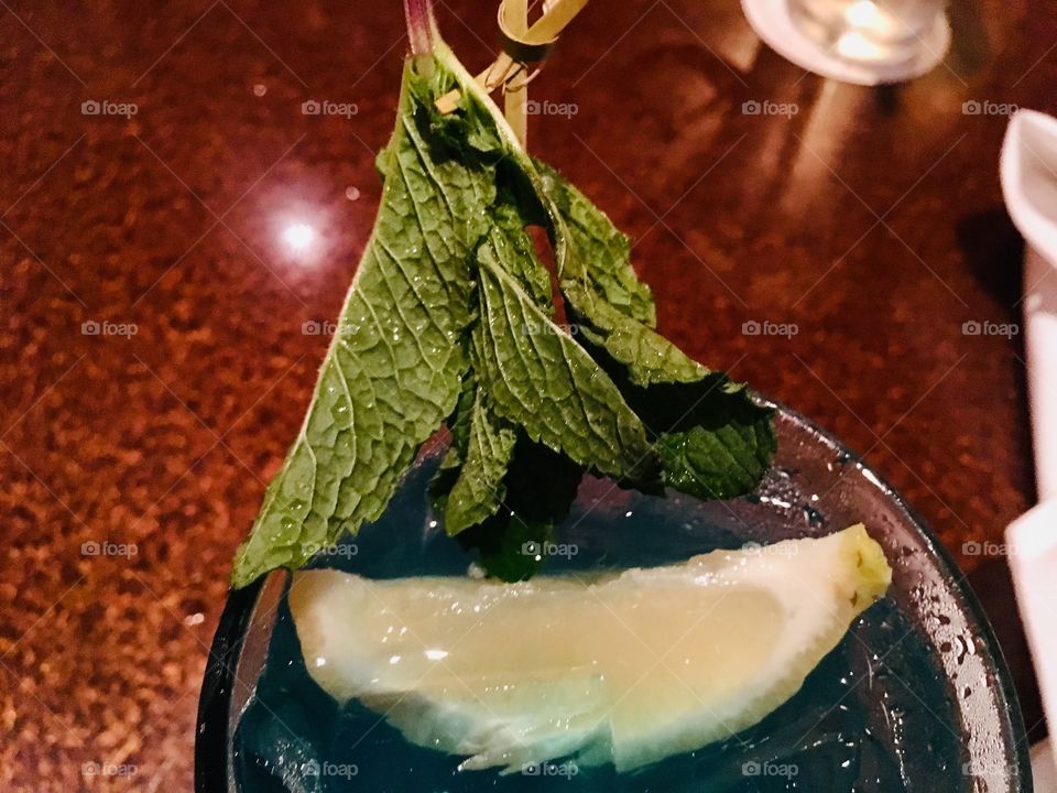 Lemon wedge and safe sail boat in my Blue Long Island ice tea at Season 52 in Orlando Florida 