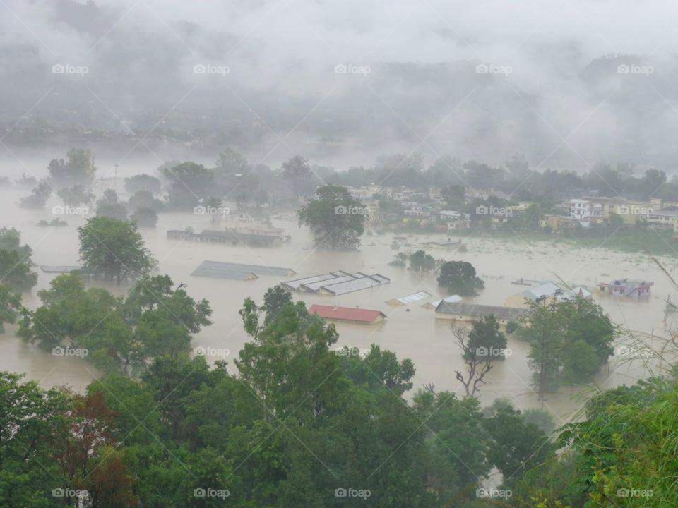unbelievable please all the houses are dumped in the water because of the flood in Uttarakhand in India due to cloud brust Uttarakhand having very beautiful sceneries mountains cloud green trees green grass beautiful places to visit