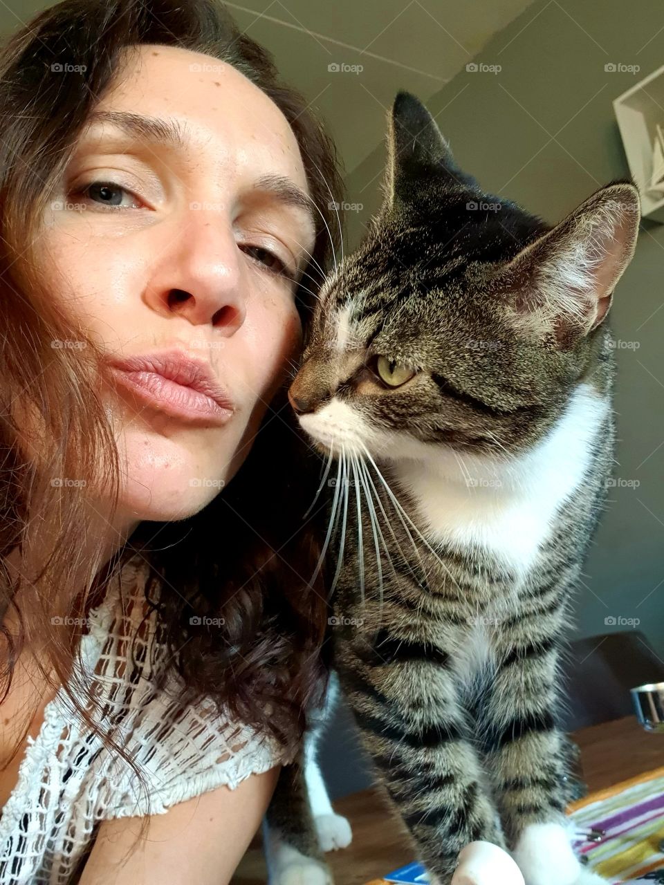 Have a nice picture together with our sweet cat tiger.