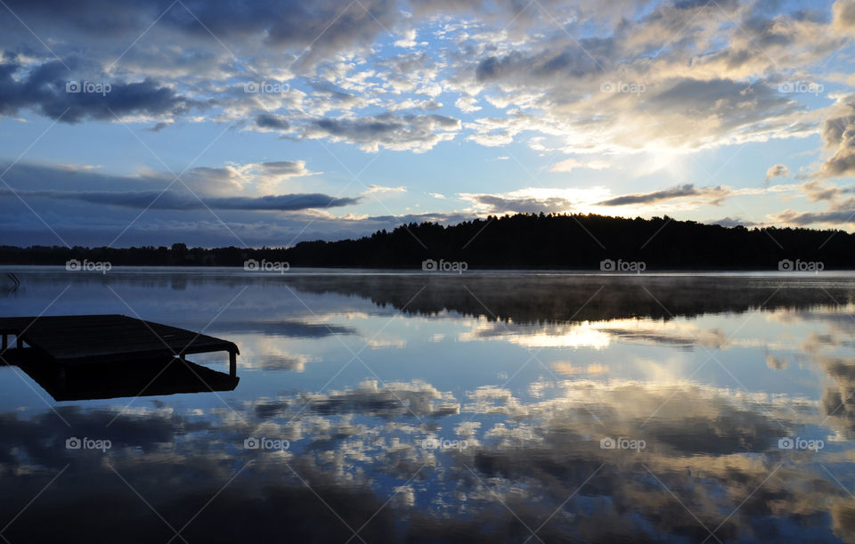 beautiful sunrise reflections on the lake in Poland