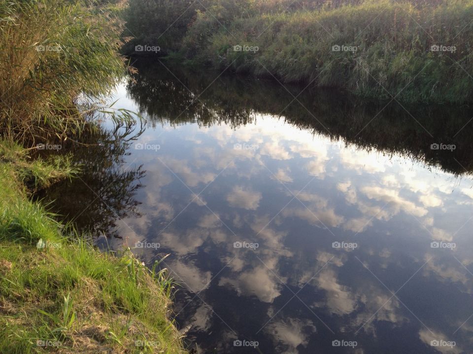 Clouds reflecting in water 