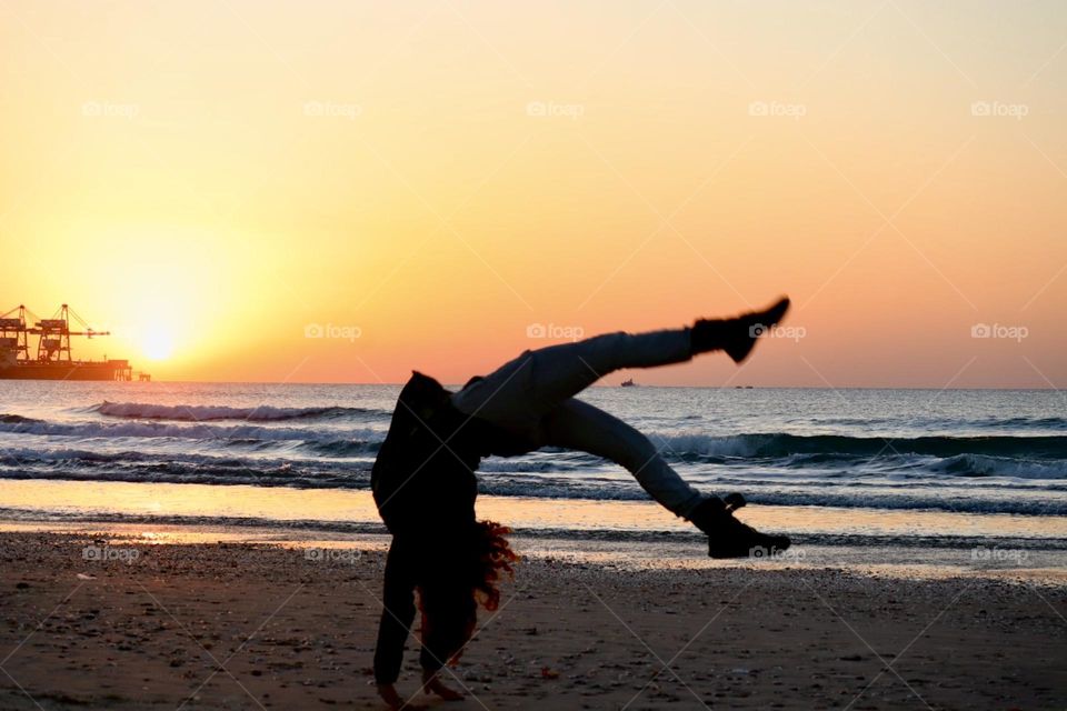 Front flip by sunset 