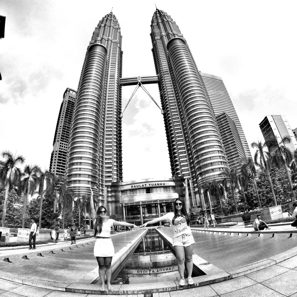 Two woman at petronas tower in malaysia