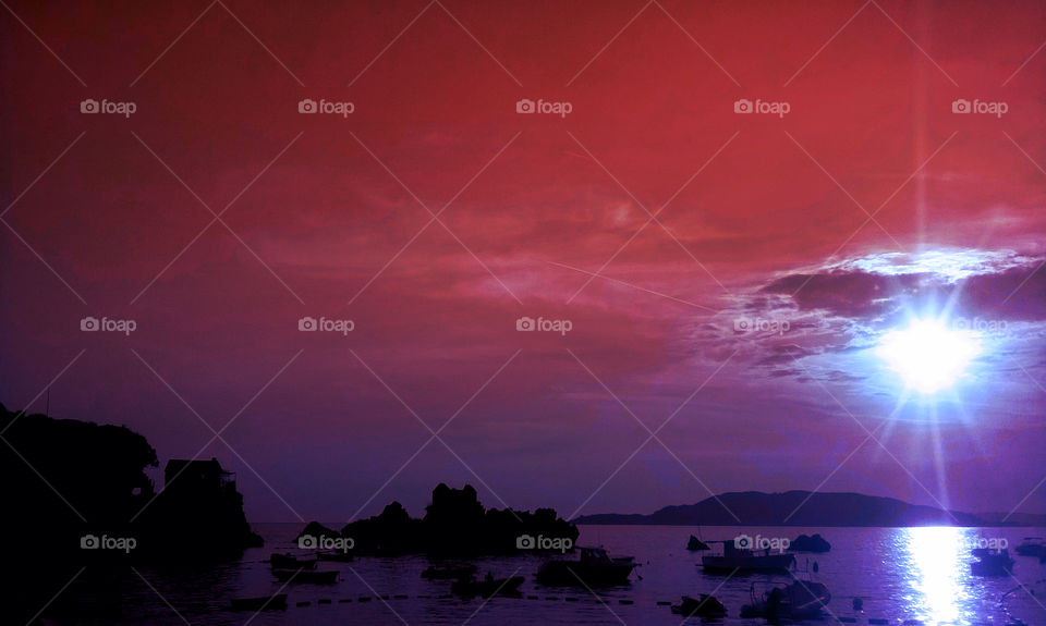 amazing pink sunset, city, beach, sea and island