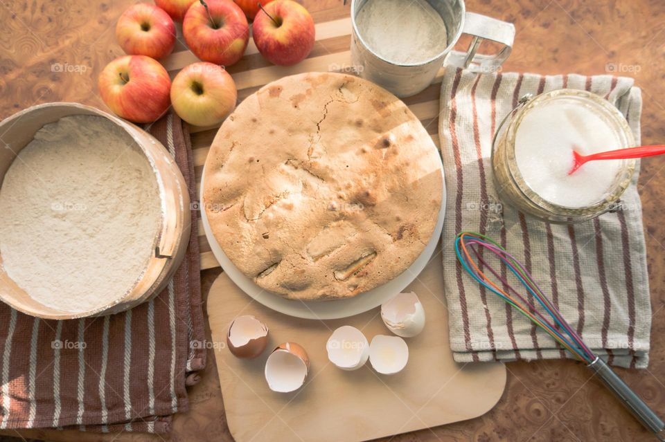 Making homemade puffed apple pie with eggs, sugar and flour.