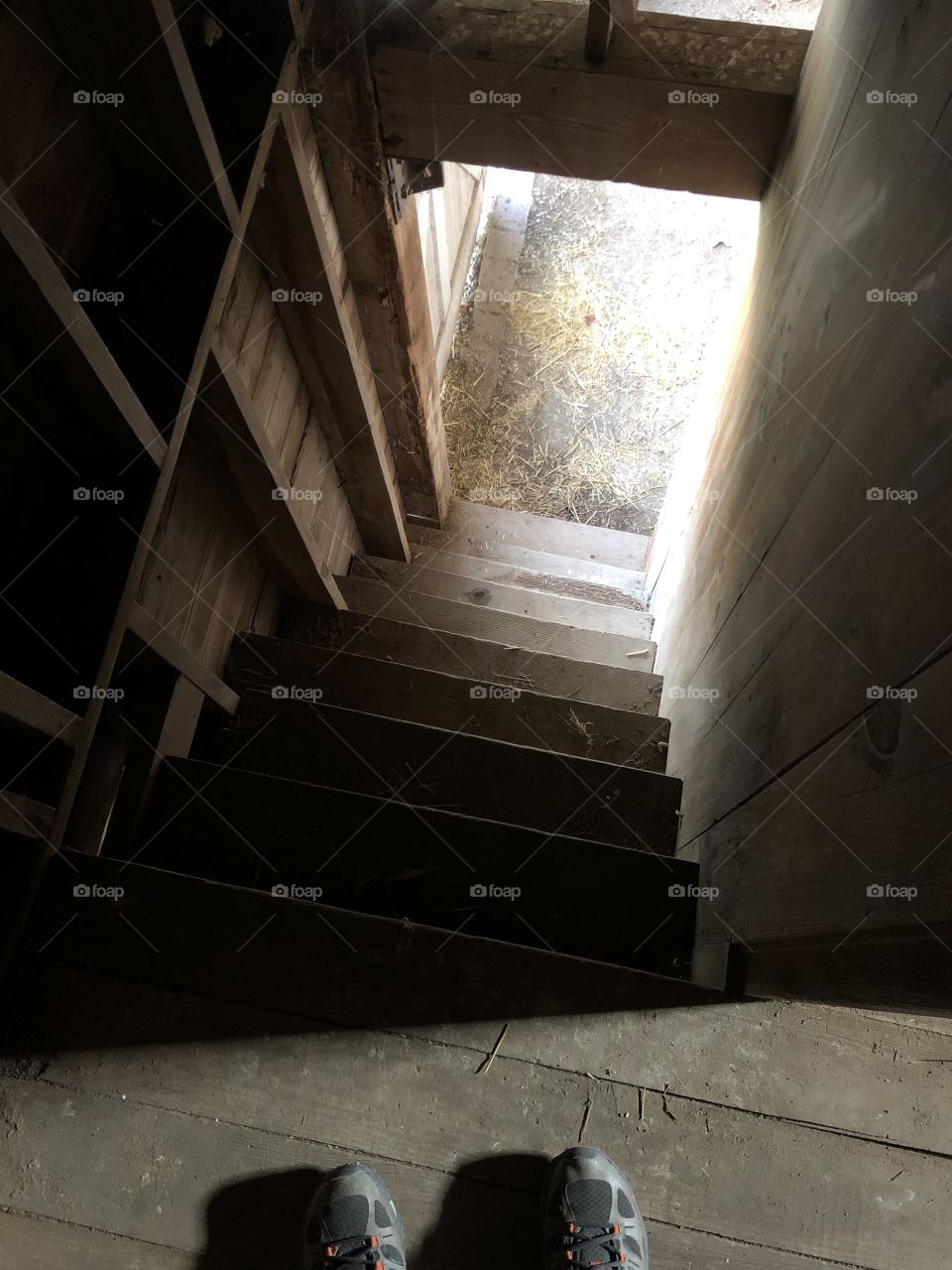 The stairs going to the hayloft from the main floor.