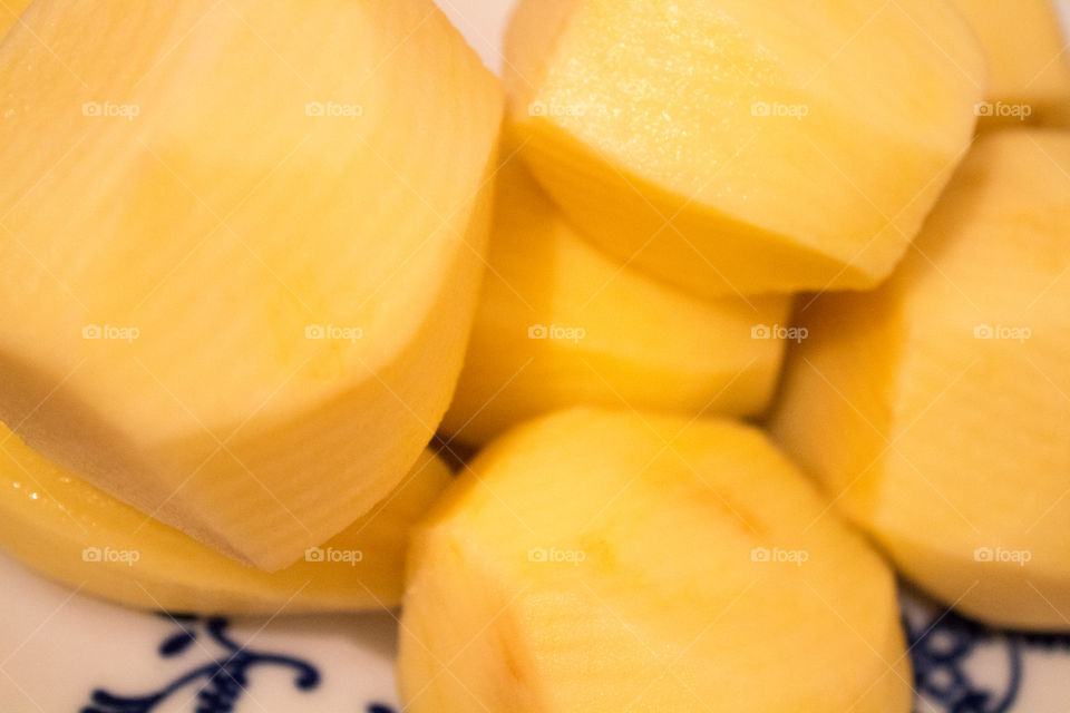 Yellow potatoes close-up in a plate ready to be prepared as ingredients