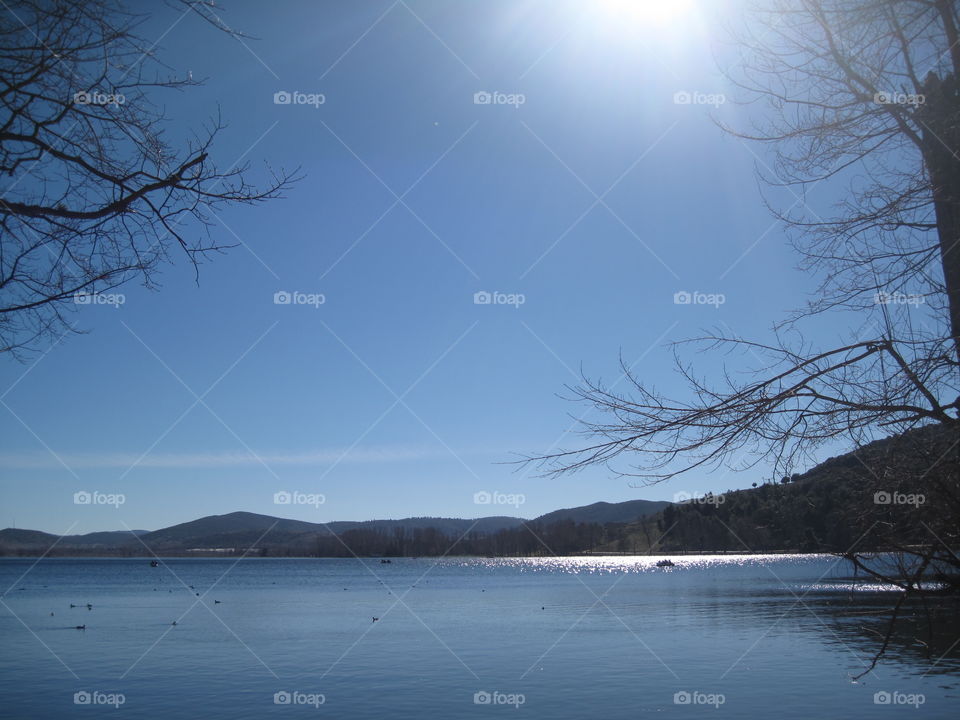 Clear water in romantic lake under bright sun