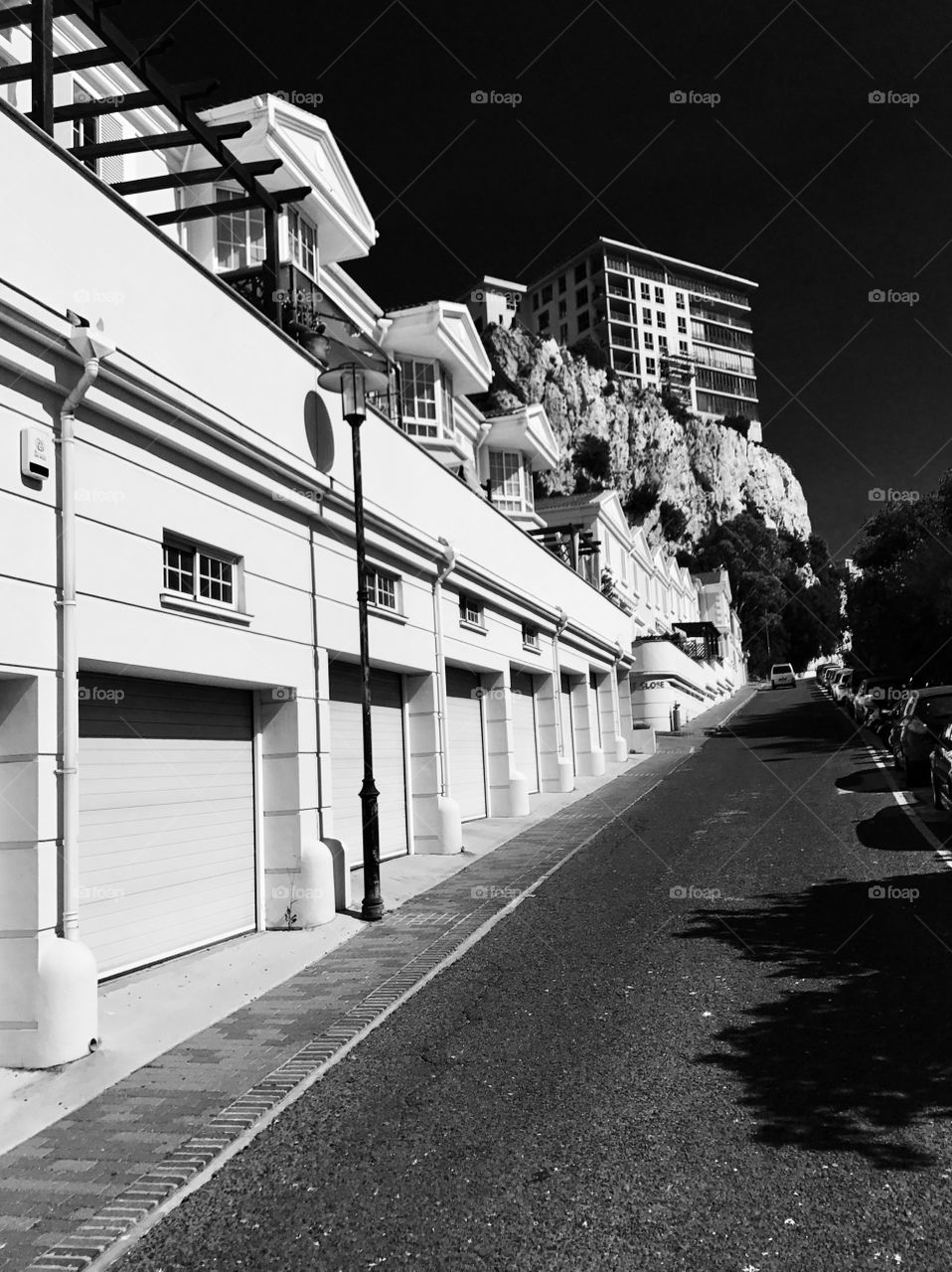 Black and white photography, hill, road, garages 