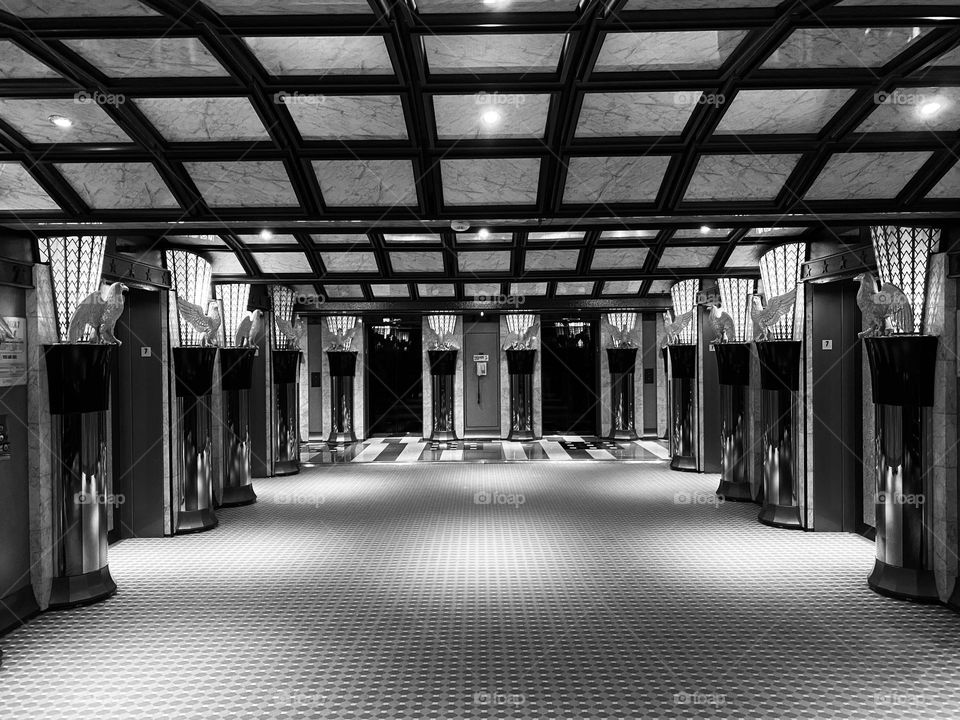 A lobby surrounded by elevators