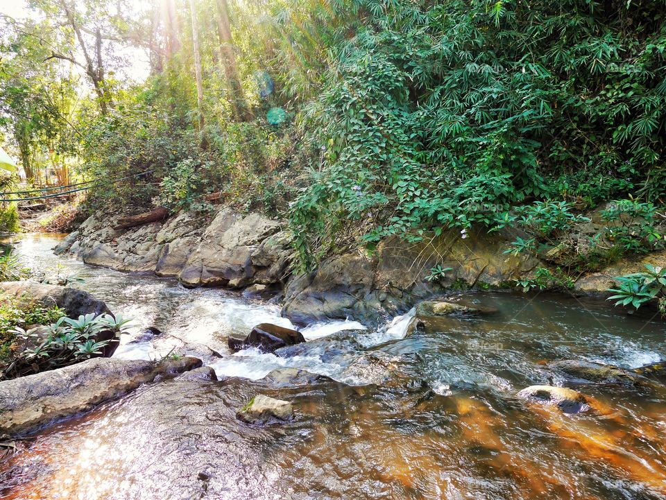 Beautiful small stream  and sunlight on the mountain in thailand