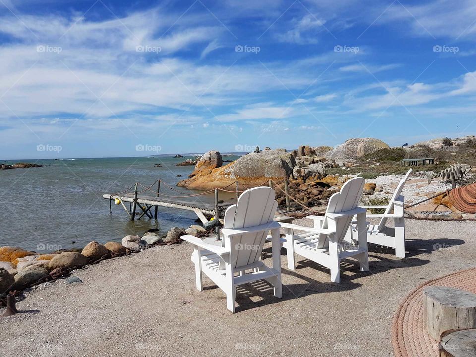 seaside chairs near atlantic ocean in conservation park