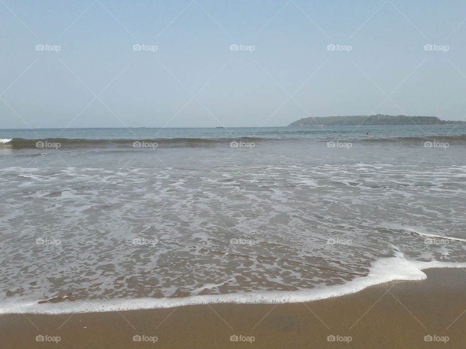 bubbles foam on waves at sand sandy seashore bubble formation