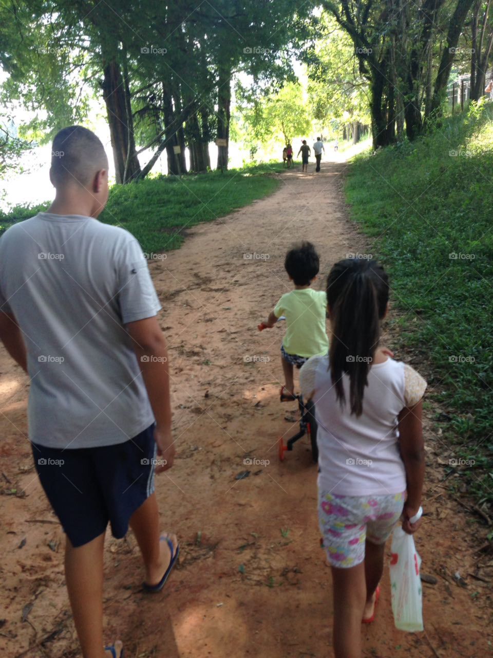 Children walking at park . warm evening.