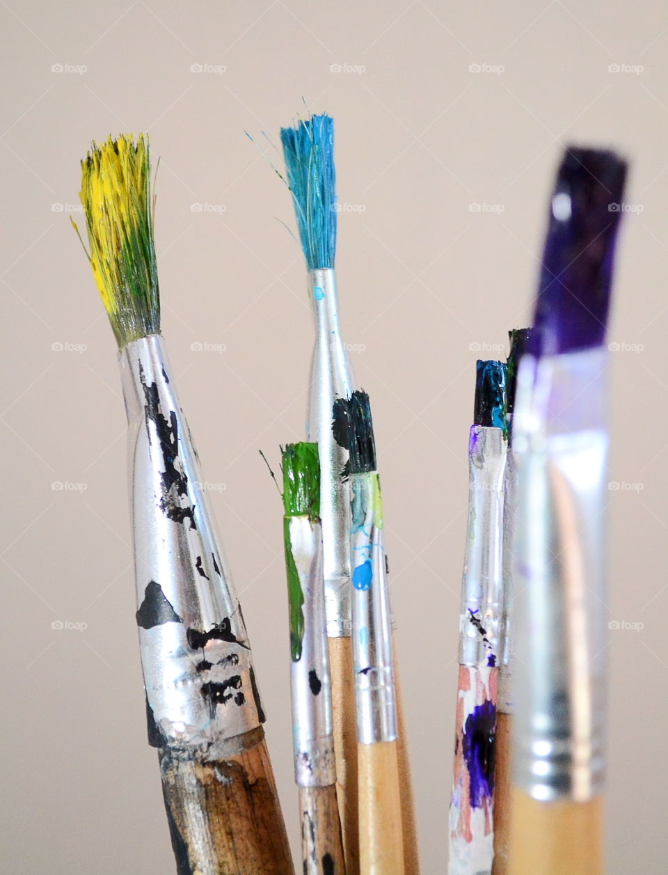 Paintbrushes against grey backgrounds