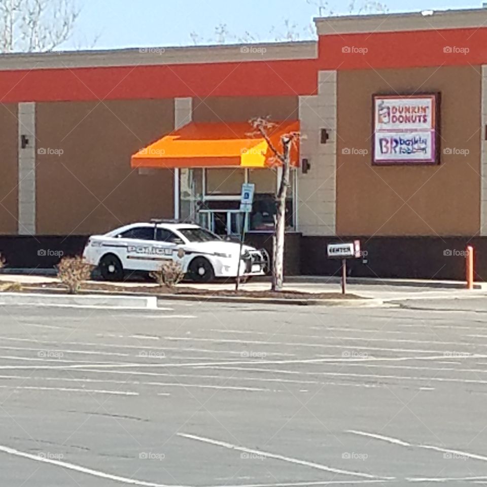 cop at donut shop,  irony