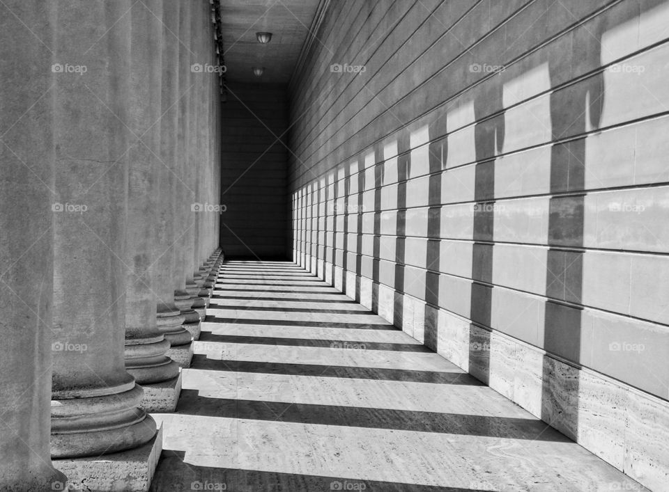 Black And White Architecture. Classical Greek Columns Receding In A Hallway