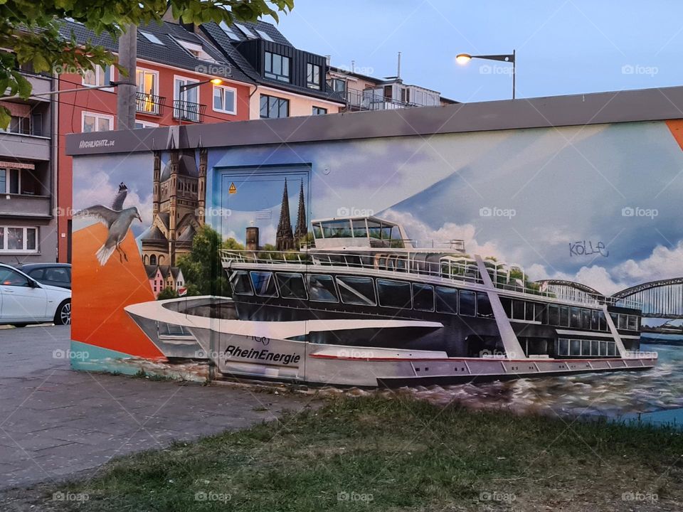 Here's a colorful painting of the cruise ship that is located in köln Germany.