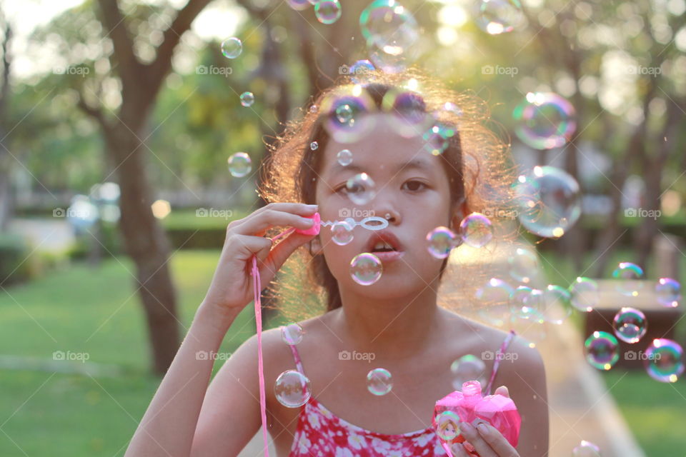 Girl playing bubble 