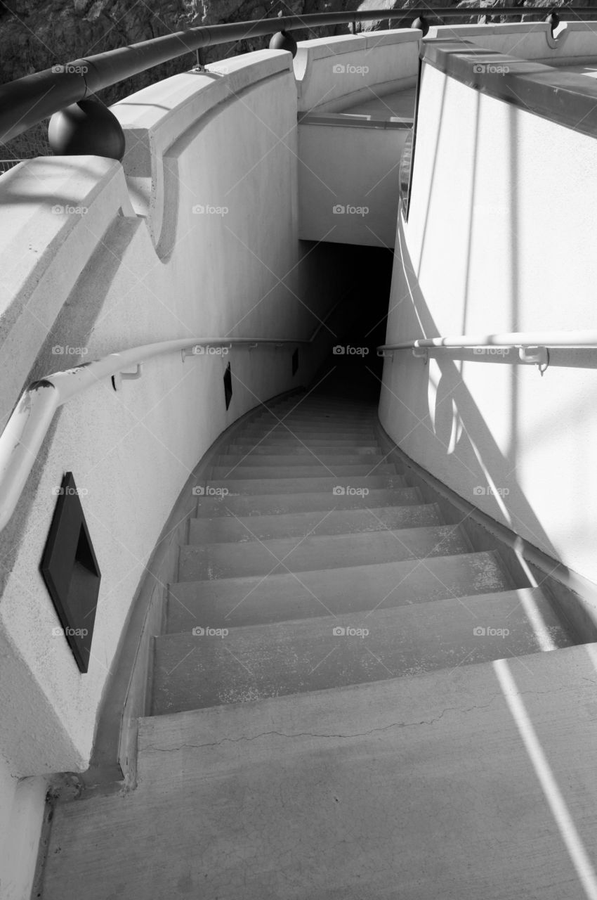 Curved stairwell. Photo taken at Hoover Dam.  Art Deco time period for construction.  Black and white photo.