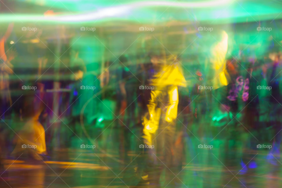 People dancing in a night club. Abstract art.