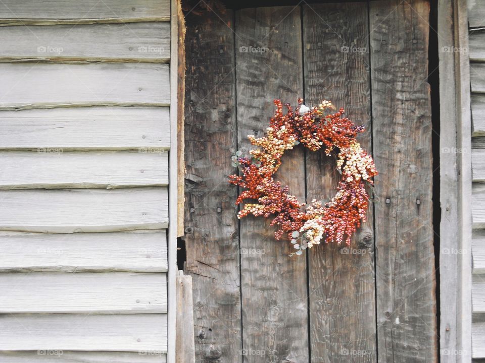 Wreath on very old wooden door