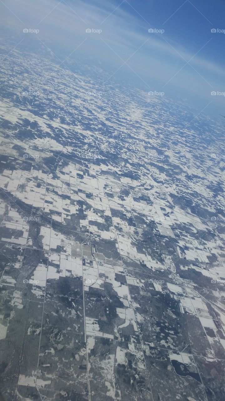 The land scape as seen from up in an airplane.