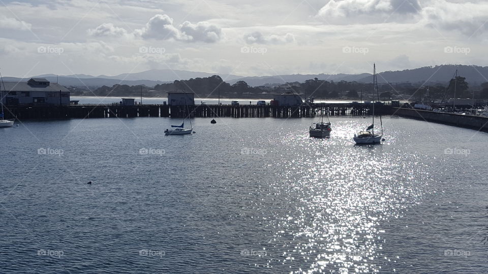 a view of beautiful monterey bay on an early cool cloudy morning. taken from the viewing spot ontop of a restaurant.