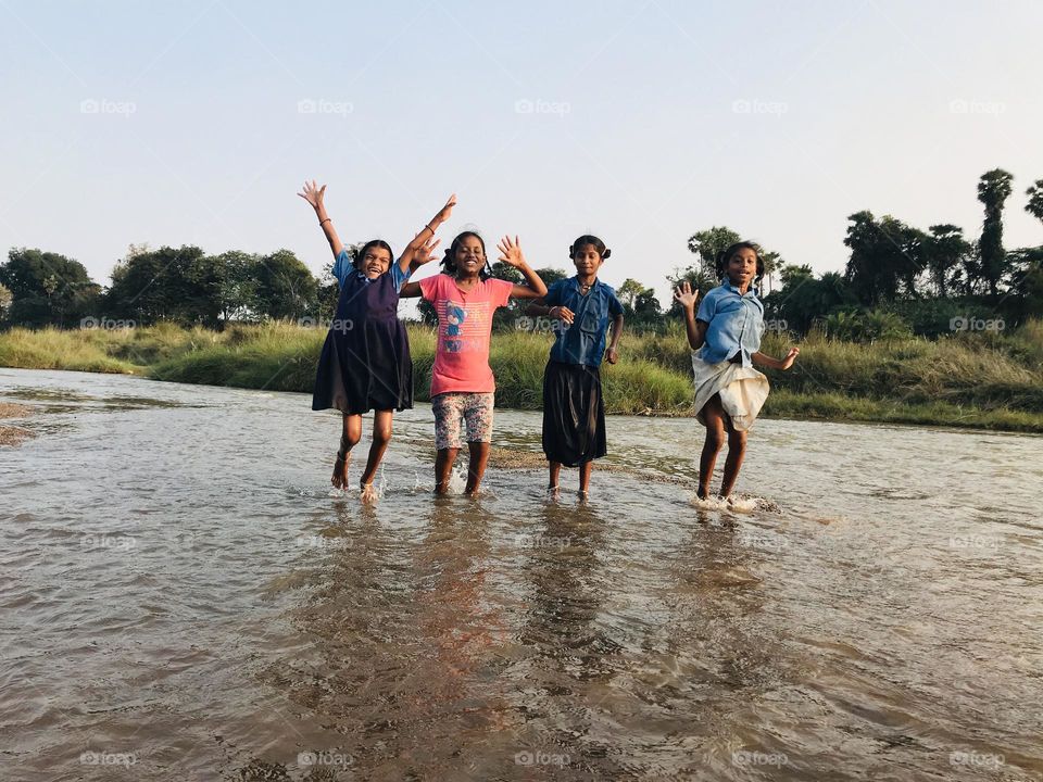 kids playing in  water and enjoying