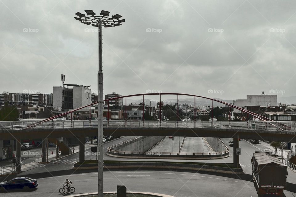 Pedestrian walkway on a road. Automobile traffic on an oval. Traffic in the city