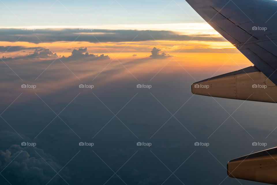 Sunset on airplane flying
