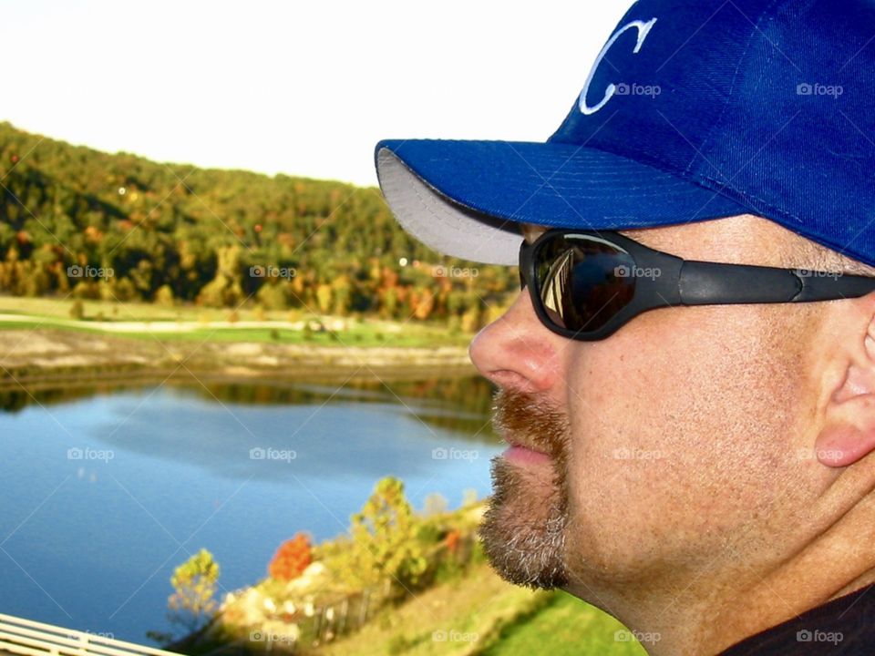 Man looking at lake