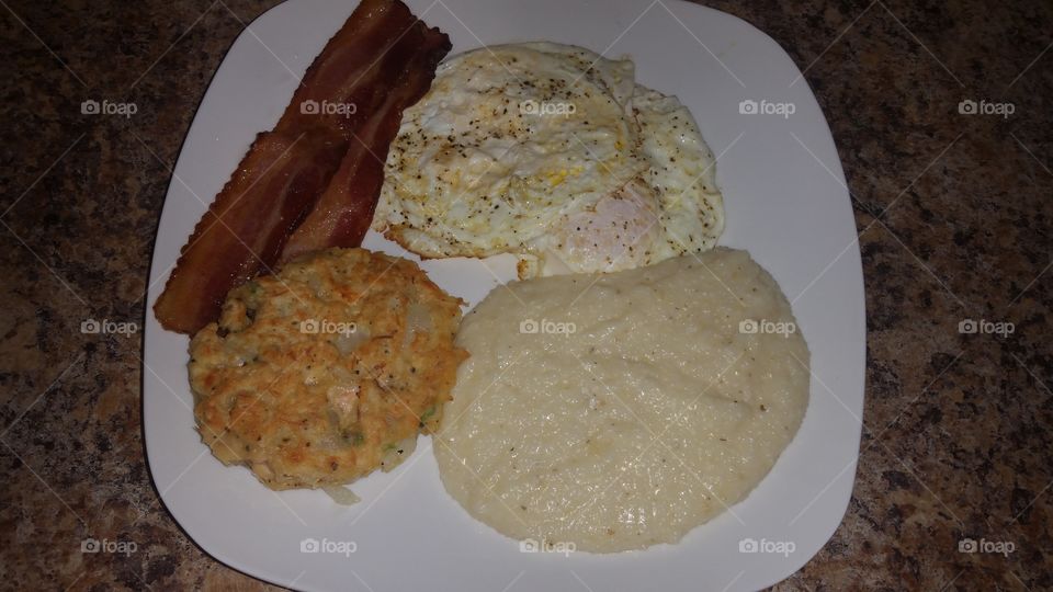 homemade salmon patties,bacon,eggs and grits