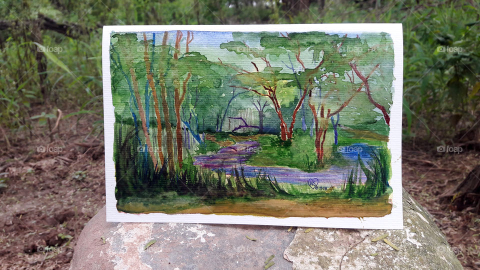 Watercolour Painting of reflection of branch in water.