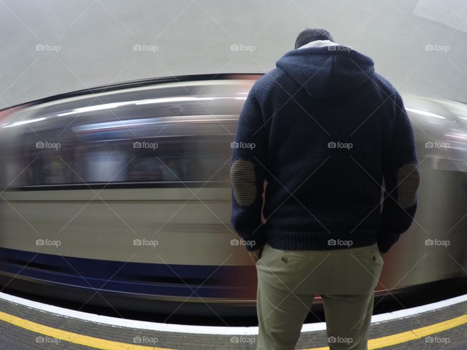 Man in the London Underground/ subway- moving train motion blur