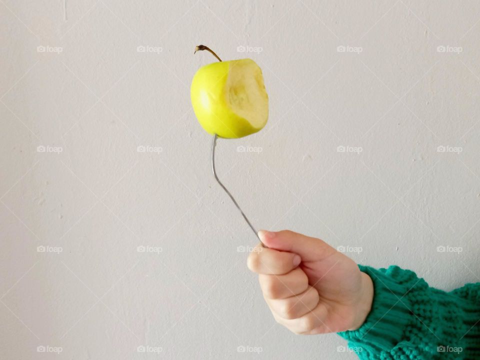 fork with a bitten apple.