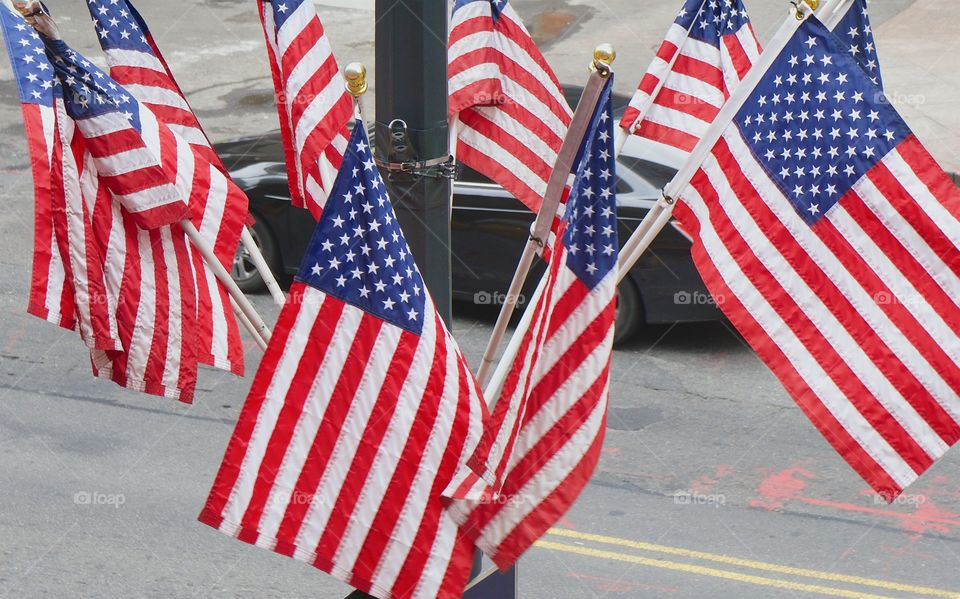A bird's eye view of multiple American Flags.