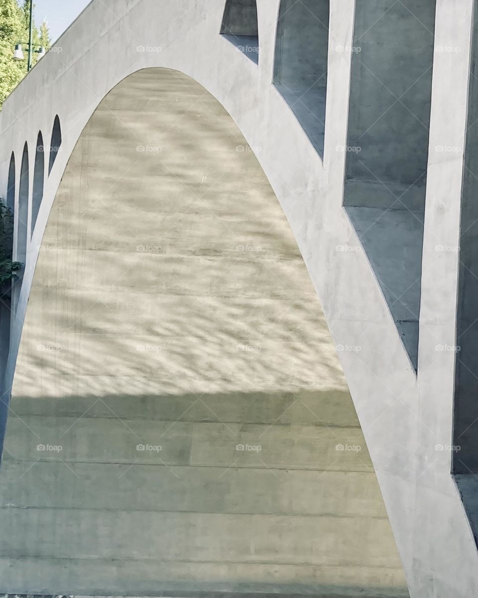 A part of the bridge and the reflection of water surface