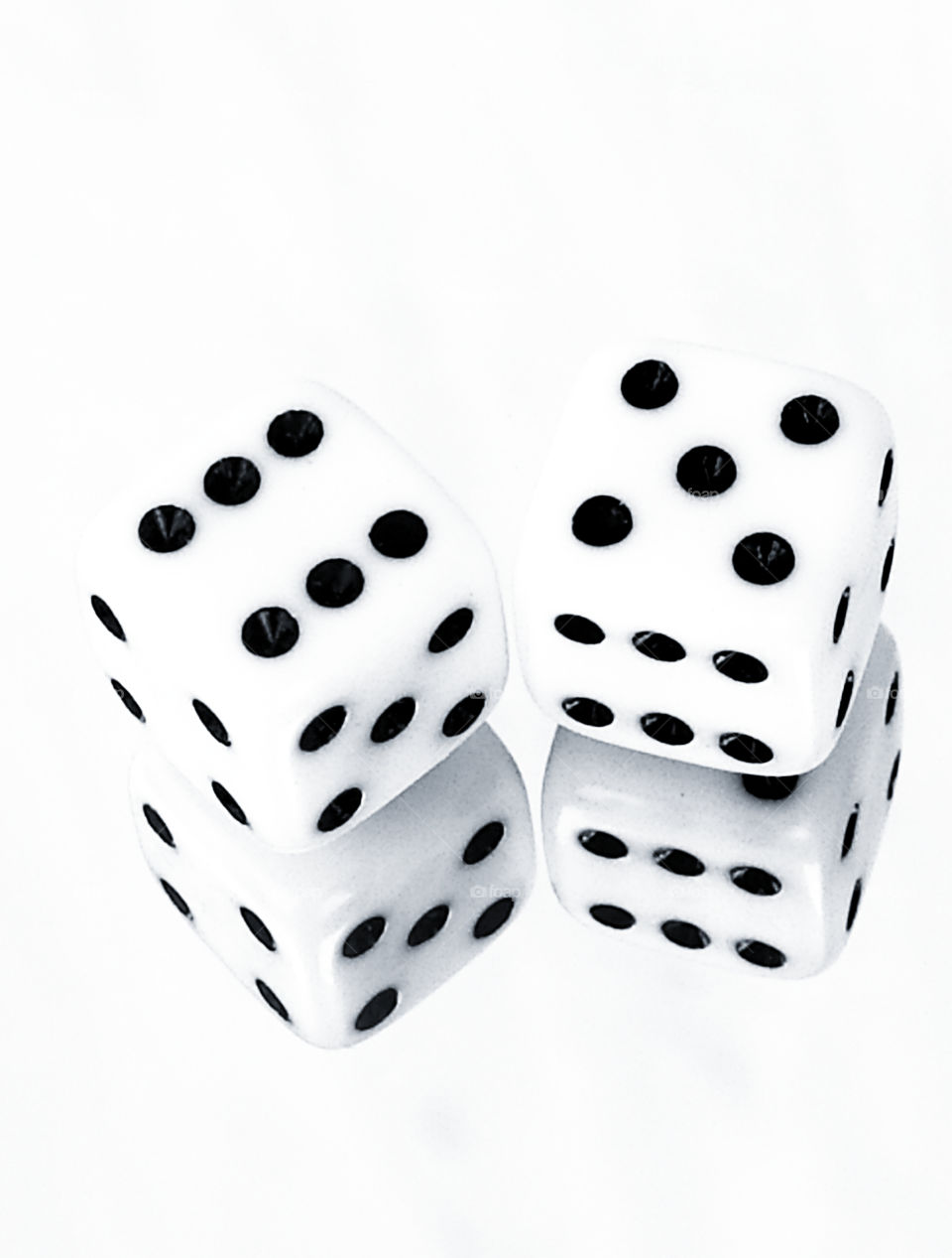 Two dice on a mirror surface