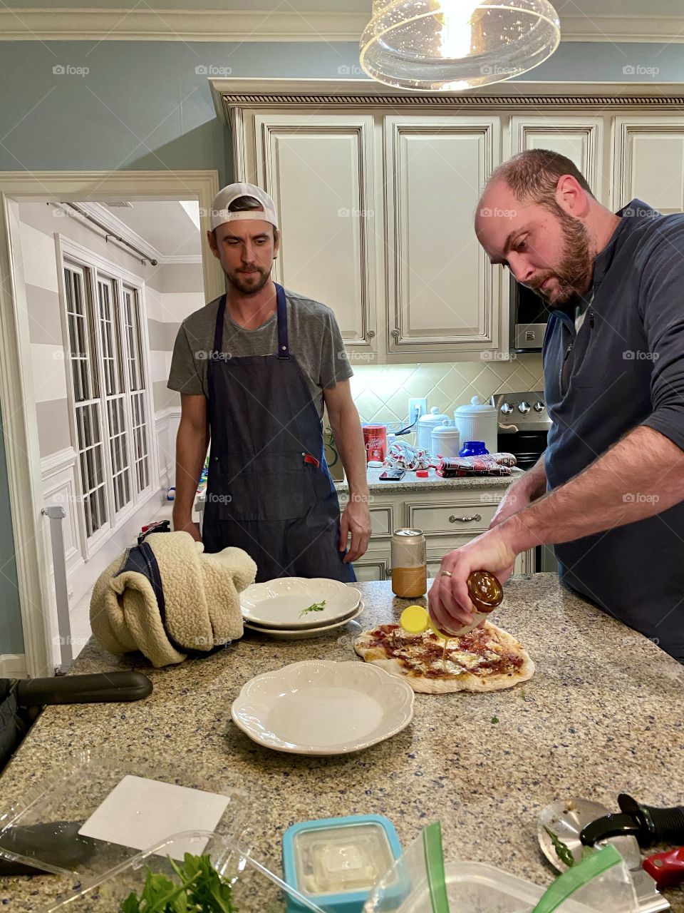 Teaching friends how to make pizza