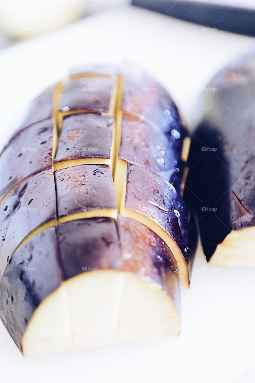 Eggplant in pieces with water droplets 