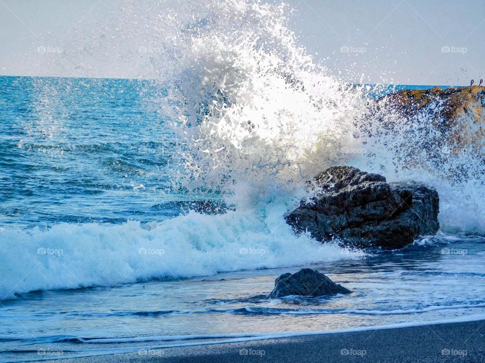 wave hitting rock