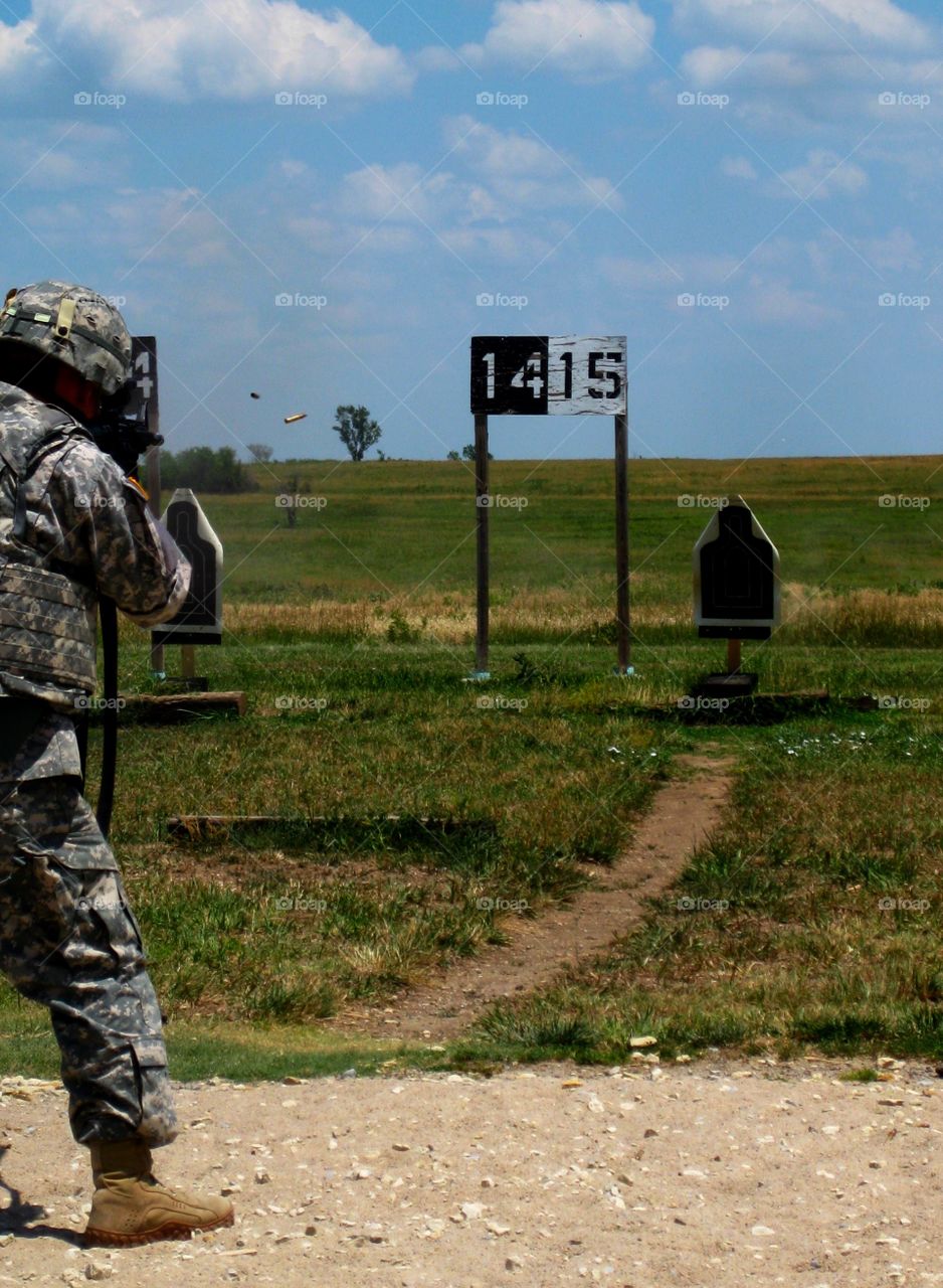 On the Range. Bullet leaving Soldier's M4 on the range