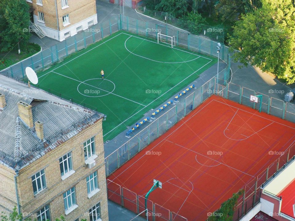 football stadium and tennis court in the courtyard of the houses