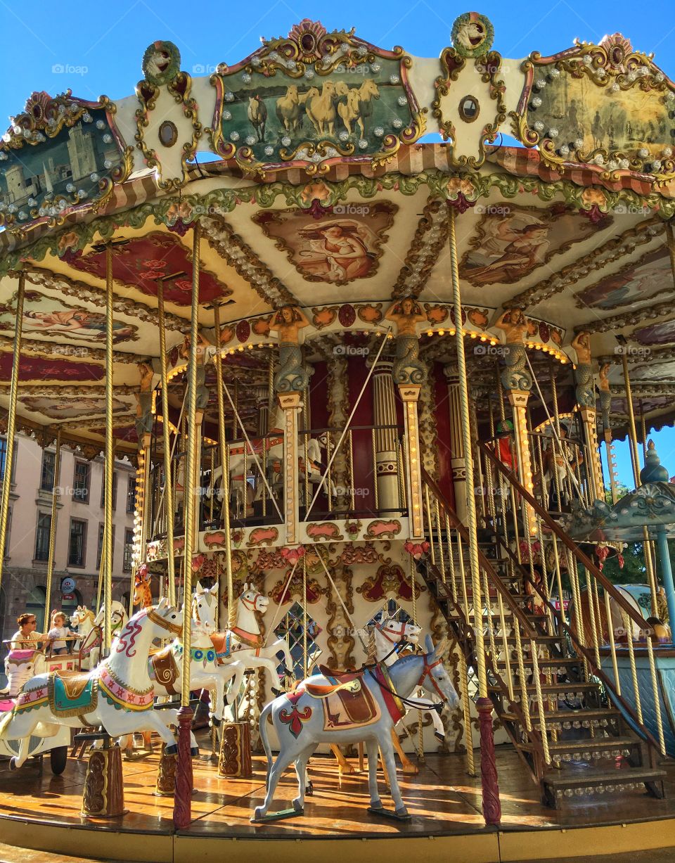 View of an old carrousel in Strasbourg city center during summer vacation 