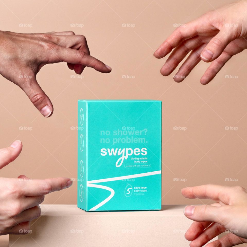 Hands grabbing a product 