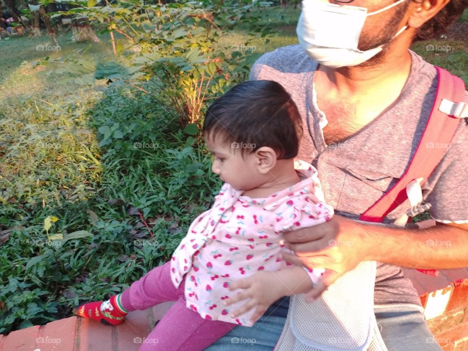 Father and Daughter sitting in the sunlight