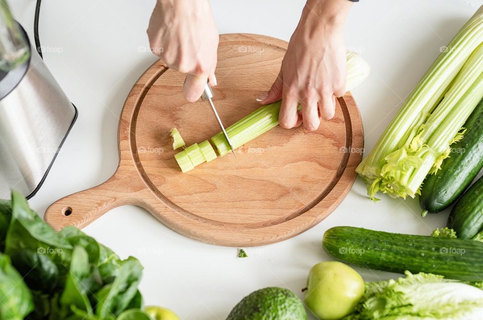 woman cutting celery